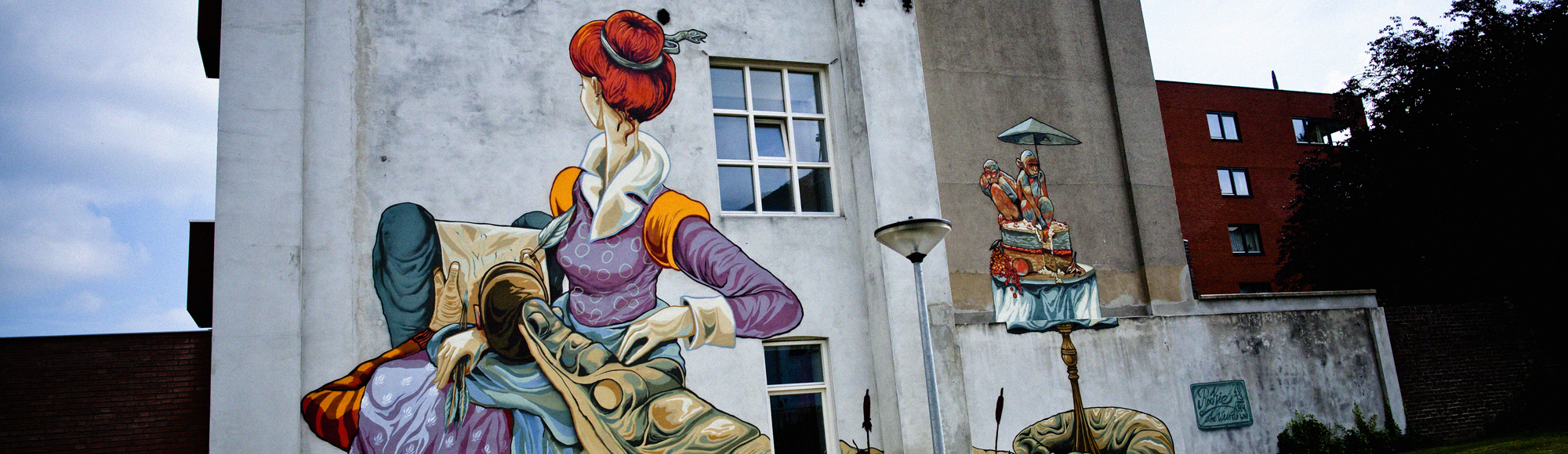 Een mural van een Middeleeuwse dame op een oud pand in Parkstad